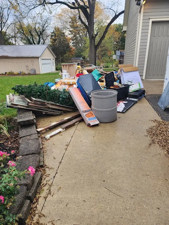 Dumpster being loaded with debris for Commercial Dumpster Rental in Billerica